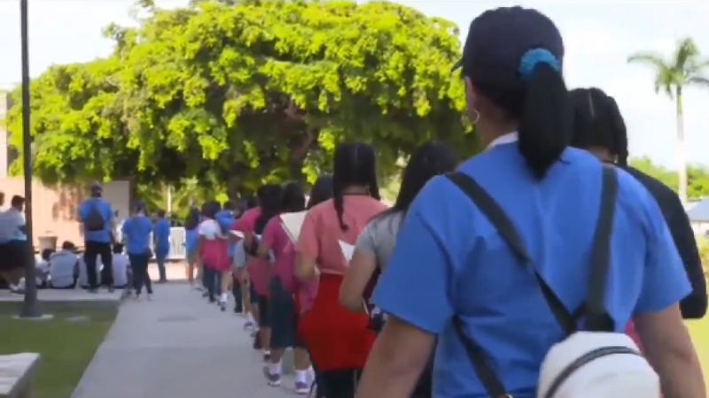 A Group of People Walking in A Line Outdoors in Evansville